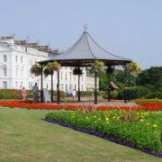 A View of the bandstand with the Victorian buildings of the Crescent in the background