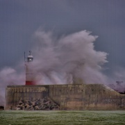 Waves Crashing Over the Lighthouse at Newhaven in Sussex