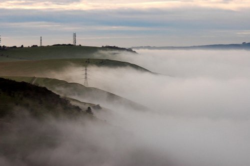 Fog rolls over the South Downs on the Fulking Escarpment, West Sussex