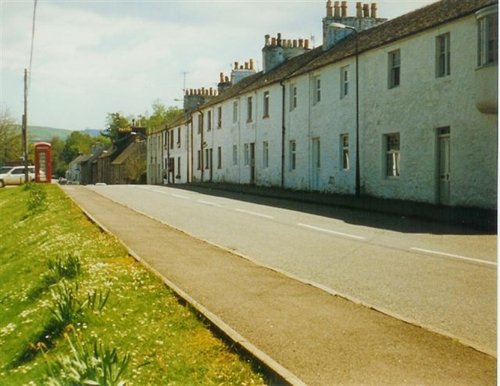 This is the main street of Fintry, Stirling, Scotland. The picture was taken in May of 1997.