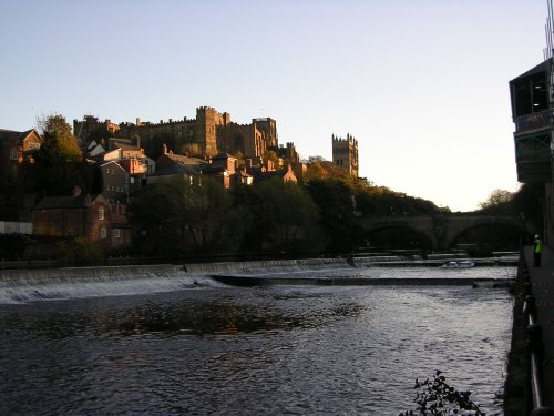 The low autumn sun lights up Durham Castle and Cathedral. Viewed from Framwellgate Waterside.