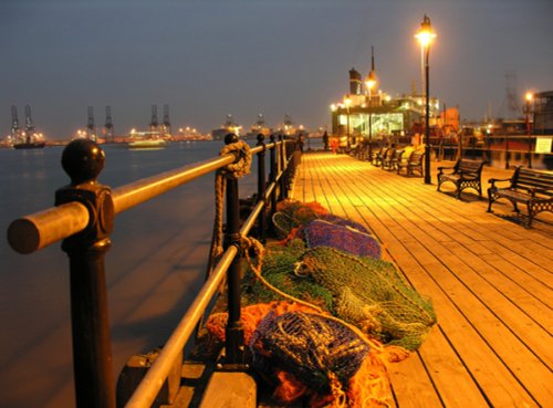 Harwich's historic Ha'penny Pier at night, Looking towards Felixstowe Docks. Essex