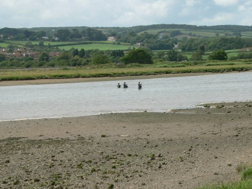Fishing in the river Axe at Axmouth, Devon