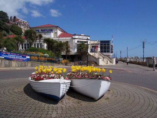 Spa Pavilion and boats used as flower planters at Felixstowe, Suffolk.