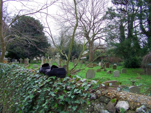 Who put shoes on the church wall?