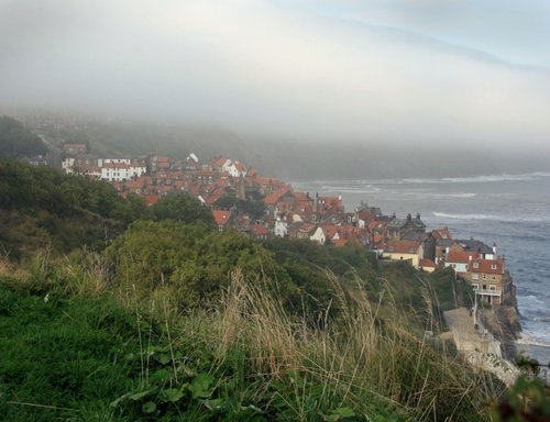 Mist rolling in over Robin Hood's Bay