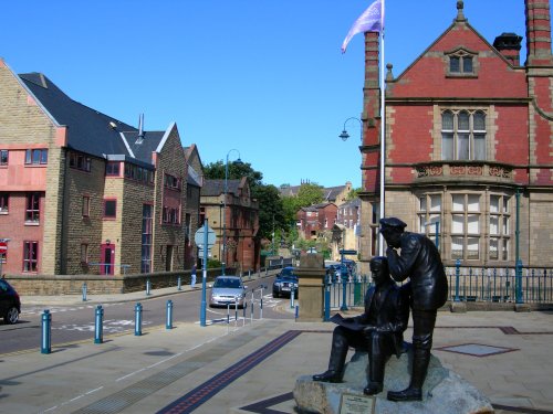 Bronze figures outside the Old Market Hall, Stalybridge