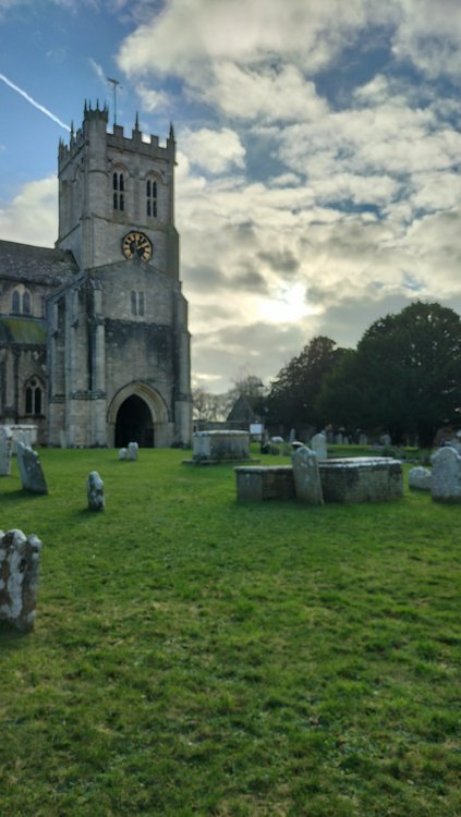 The Priory church in Christchurch with an attractive sky behind