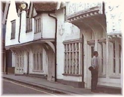 Window shopping in Lankester Antiques, once a Medieval merchant's home. Saffron Walden, Essex.