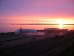 Sunset over Hilbre Island - taken from West Kirby promenade, Wirral, Merseyside