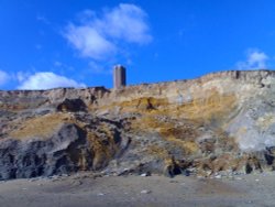 The historic Light house tower (The Naze Tower) from the beach at Walton-on-the-Naze, Essex