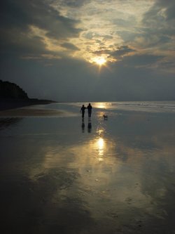 Walking the dog on Sheringham beach in the evening