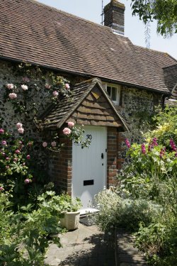 Cottage in village with  flowers
