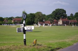 Cricket on the green at Lurgashall, Sussex.  2 July 2011