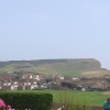 A picture taken walking along a road in Seaford. Beachy Head is in the background.