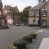 Falkland Palace, top left, Town Hall and floral bordered street, Falkland, Fife.