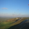 Paragliders flying over Westbury White Horse, Wiltshire