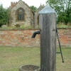The All Saints Church in Harbury, Warwickshire, with a very old well...