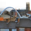 Trinity Church in Bolton, Lancashire. The arch is the new rail bridge over Newport St.