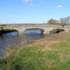 Langport. View of the bridge over the river Parrett, from the bank.