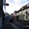Tring, Hertfordshire. Post Office sign and main street through Tring