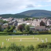 Millom cricket ground, match in progress.