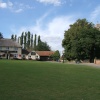 Cavendish village green looking towards The Five Bells pub and church