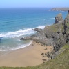 As the tide recedes at Bedruthan Steps, sandy coves are uncovered