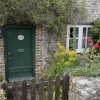 Cottage in village with flowers