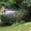 Outhouse in the shade.