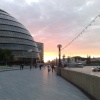The Sun sets behind City Hall