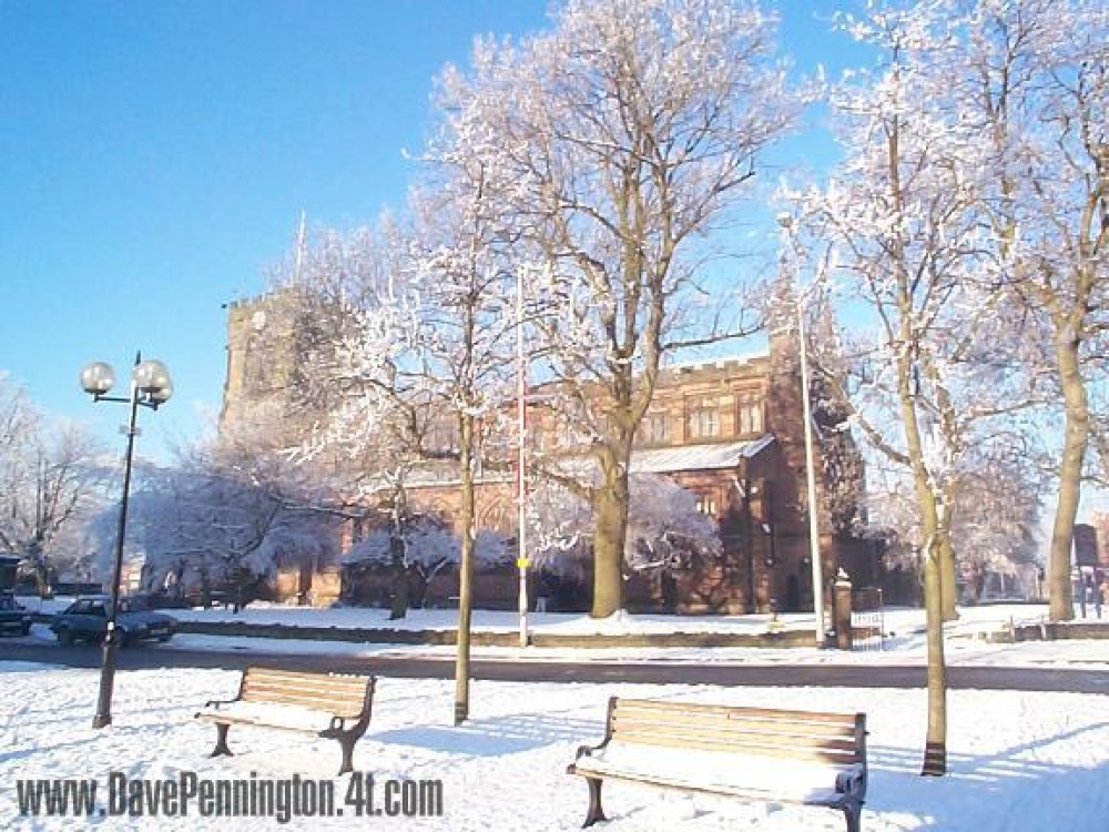 A snow covered Leigh Parish Church