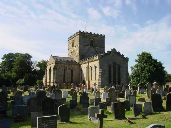 A summers day view of St Oswald's Church.