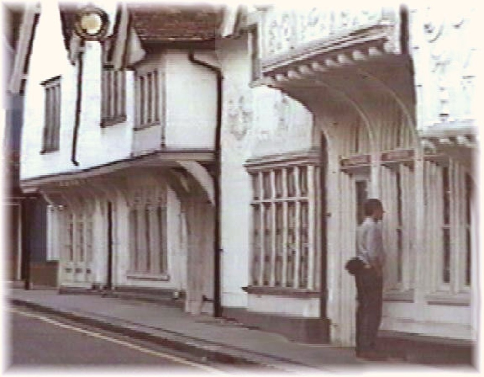 Window shopping in Lankester Antiques, once a Medieval merchant's home.  Saffron Walden, Essex.