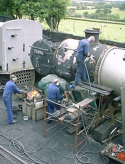 Rivetting on the smokebox of #73096 at Ropley Loco Shed