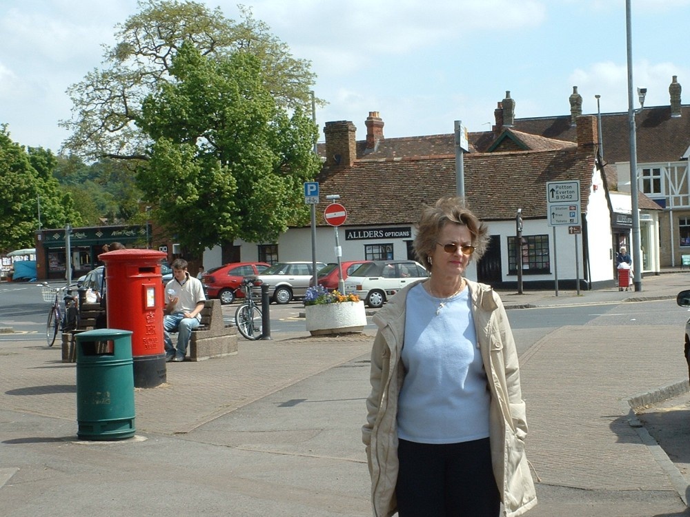 Photograph of My wife Lynne in Sandy town center, outside the Postoffice.
