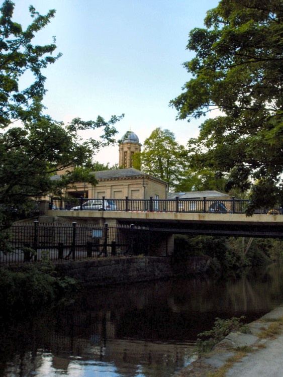 A view of the Bridge and Church from the canalside, Saltaire Mills.