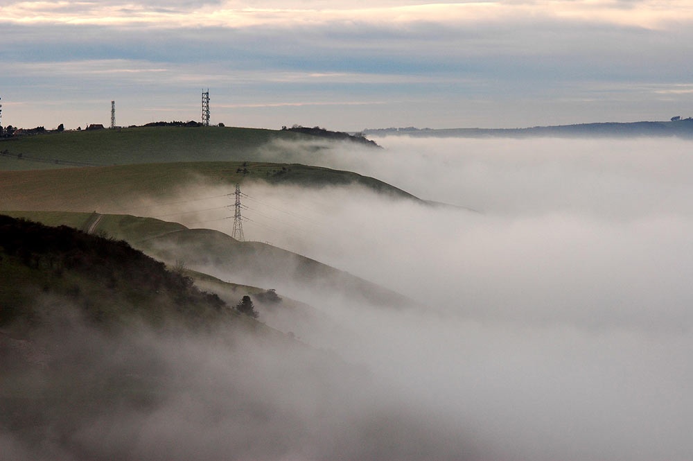 Fog rolls over the South Downs on the Fulking Escarpment, West Sussex