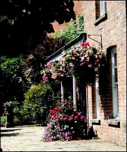 The flowery doorway of the Abbey July 2005