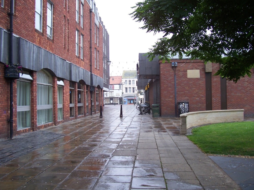One of the ways into the town shopping area from St James Square, Grimsby