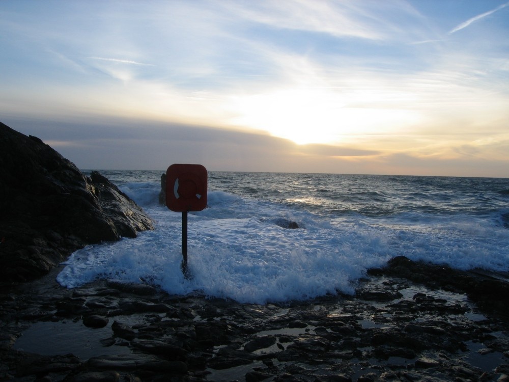 The sea rushing over Bude Breakwater, Cornwall