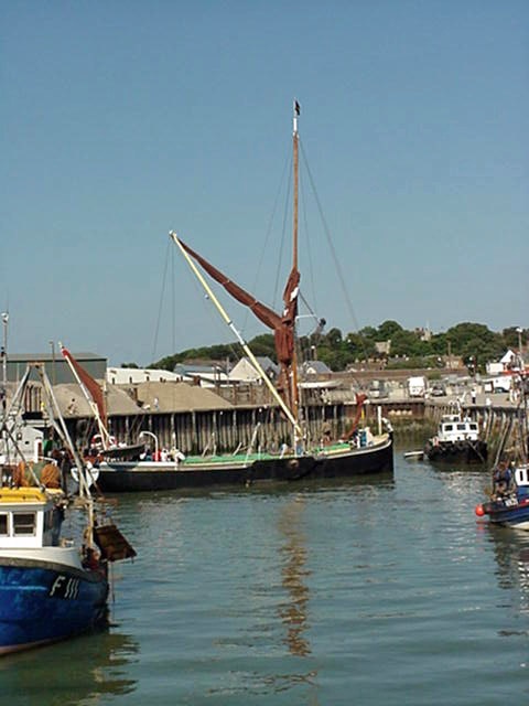 Thames barge 'Greta' coming in to harbour as the tide turns. Whitstable, Kent