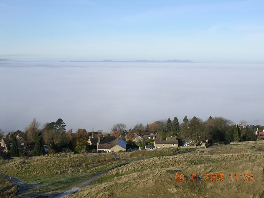 Photograph of Sea of fog from Cleeve hill nr Cheltenham with the Malvern Hills in the distance.
