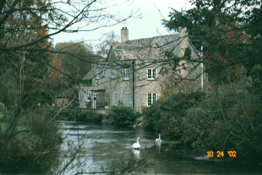 House with swans in Fairford, Gloucestershire