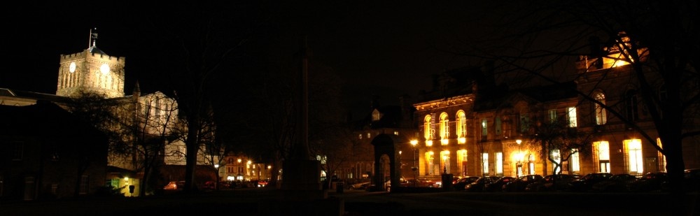 Photograph of The Queens Hall, Beaumont Street, right. And Hexham Abbey, left.