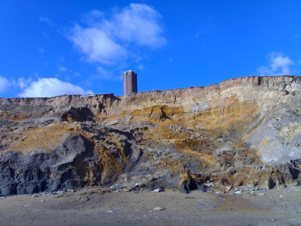The historic Light house tower (The Naze Tower) from the beach at Walton-on-the-Naze, Essex