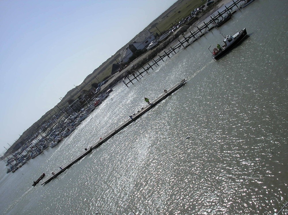 Moving pontoons to allow for dredging on the river Arun Littlehampton.