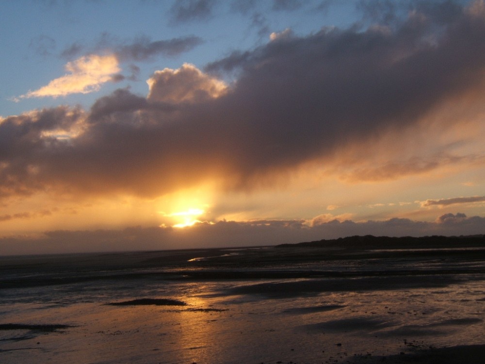 Photograph of Sunset over the shore at Haverigg, Cumbria.