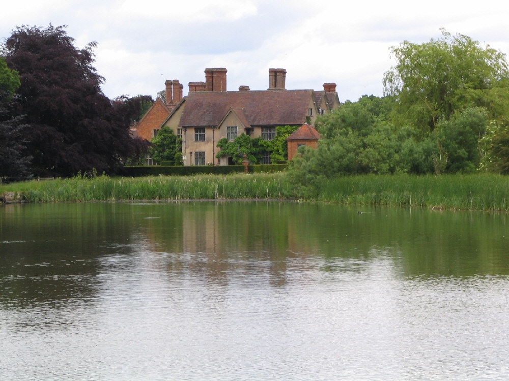 Packwood House, Warwickshire. Looking towards the house from across the pool