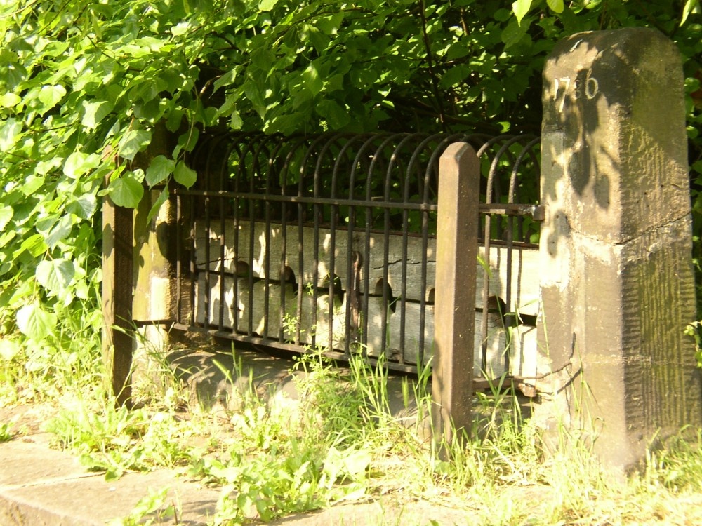 Photograph of The Village Stocks at St. Mary Magdalene's Church, Whiston (nr Rotherham), South Yorkshire.